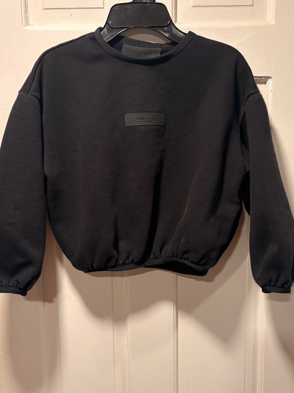 Essentials Black Crewneck Sweatshirt with Subtle Patch Logo